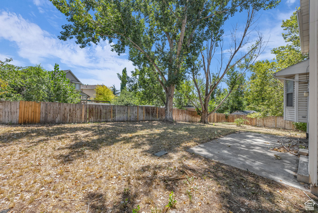 Fenced backyard featuring a patio area