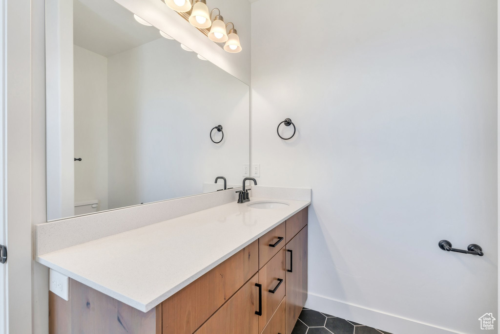 Bathroom with vanity and tile patterned floors