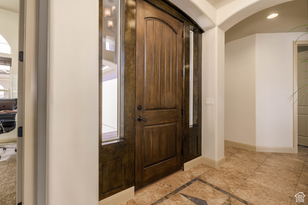 Entrance foyer featuring baseboards and recessed lighting