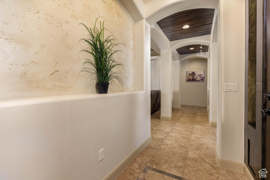 Corridor with arched walkways and recessed lighting