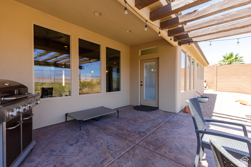 View of patio / terrace featuring a grill and a pergola
