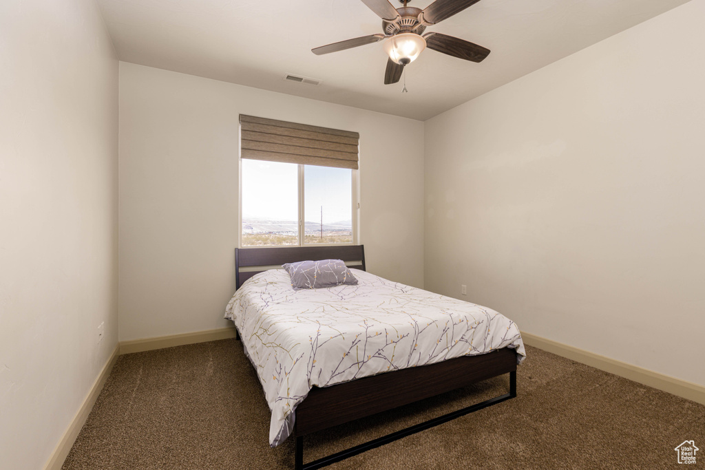 Bedroom featuring carpet flooring and ceiling fan