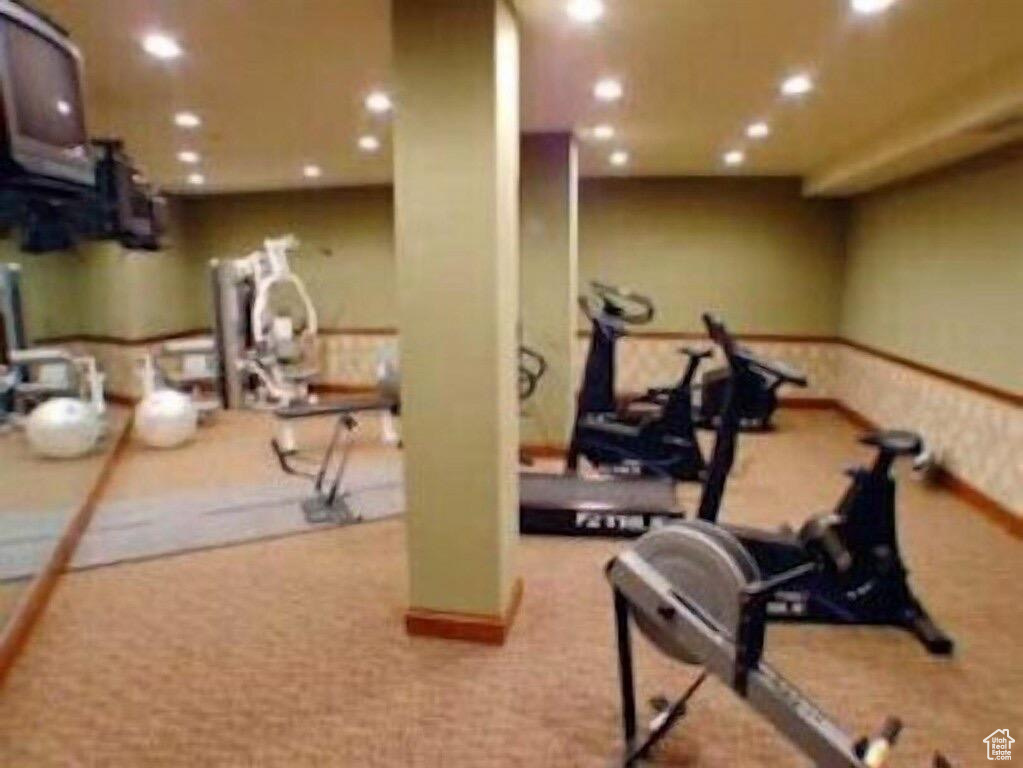 Exercise area featuring recessed lighting and carpet flooring