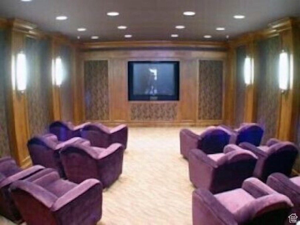 Home theater featuring light carpet, recessed lighting, and ornamental molding