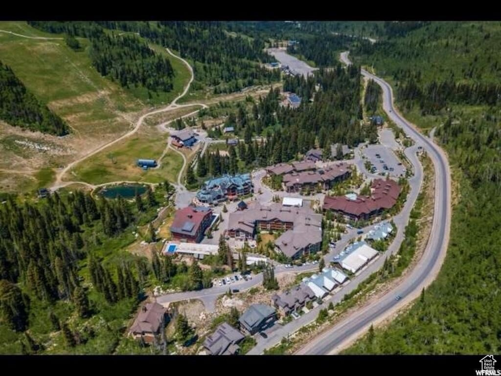 View of property location featuring a forest