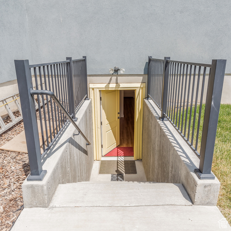 View of exterior entry with stucco siding