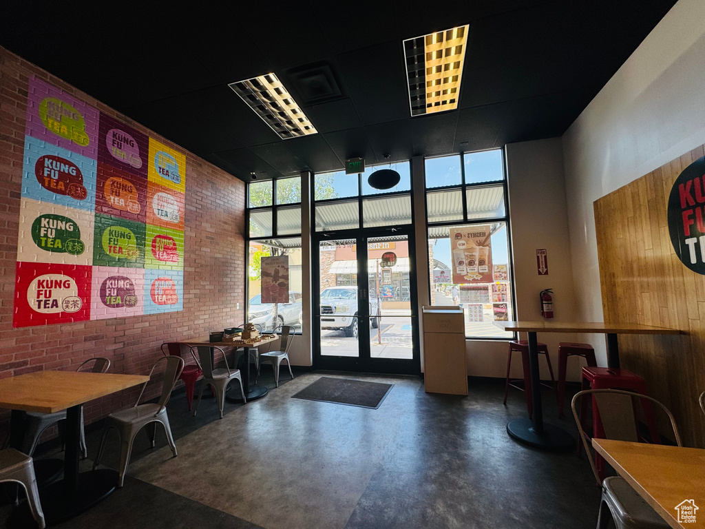 Common area with brick wall