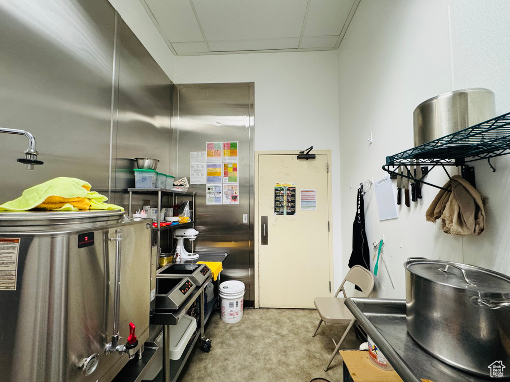 Kitchen featuring carpet and a drop ceiling