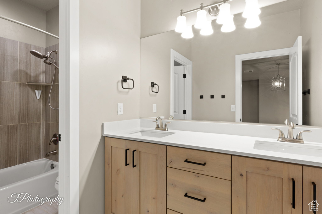 Full bath with double vanity and shower / washtub combination