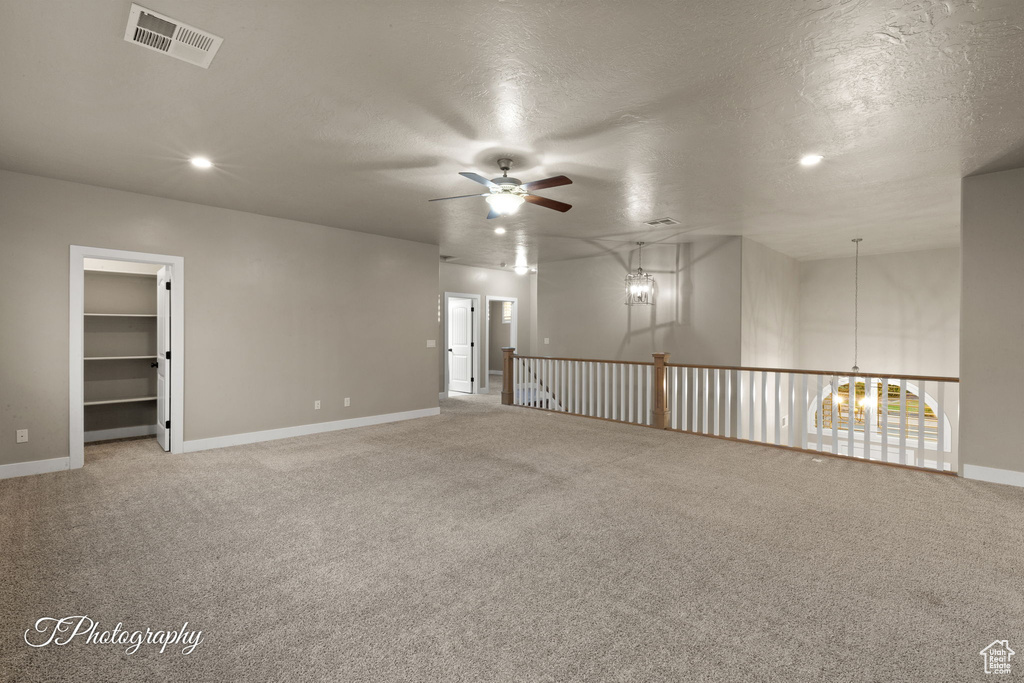 Spare room featuring ceiling fan, light colored carpet, recessed lighting, and a textured ceiling