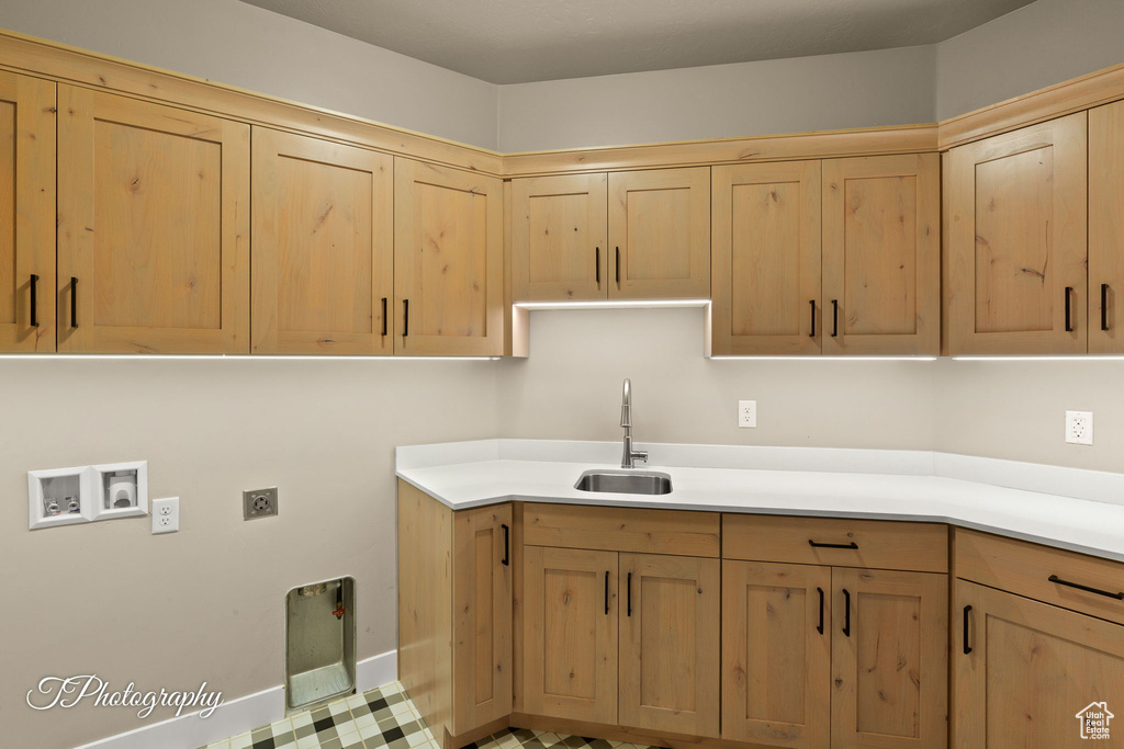 Laundry room with cabinet space, washer hookup, and hookup for an electric dryer