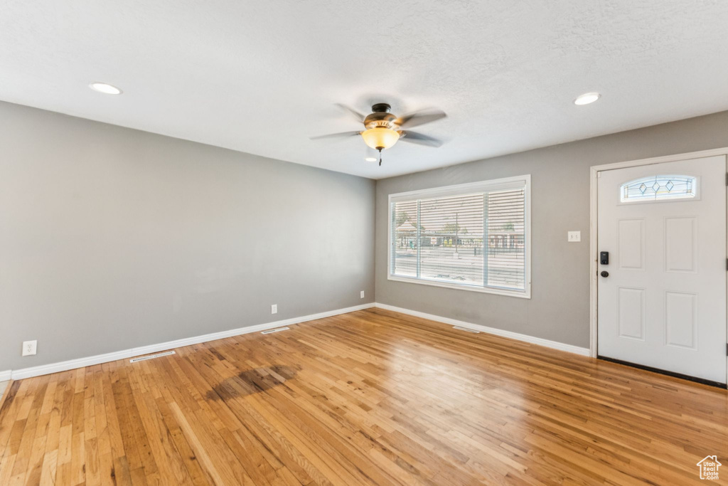 Entryway with a ceiling fan, plenty of natural light, light wood-type flooring, and recessed lighting
