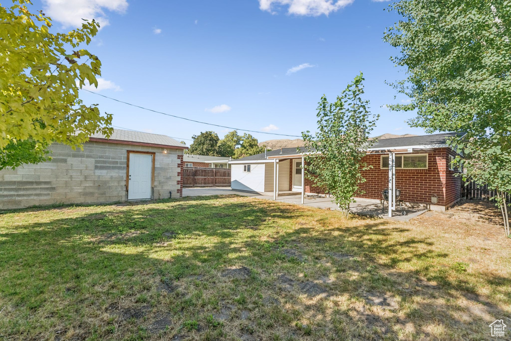 View of yard with a patio area