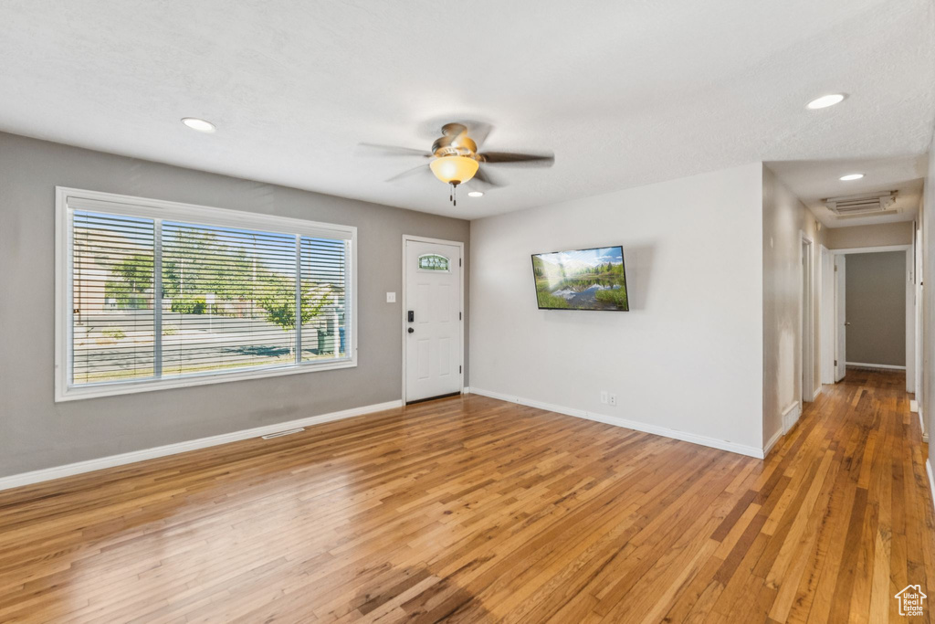 Entryway with light wood finished floors, recessed lighting, and ceiling fan