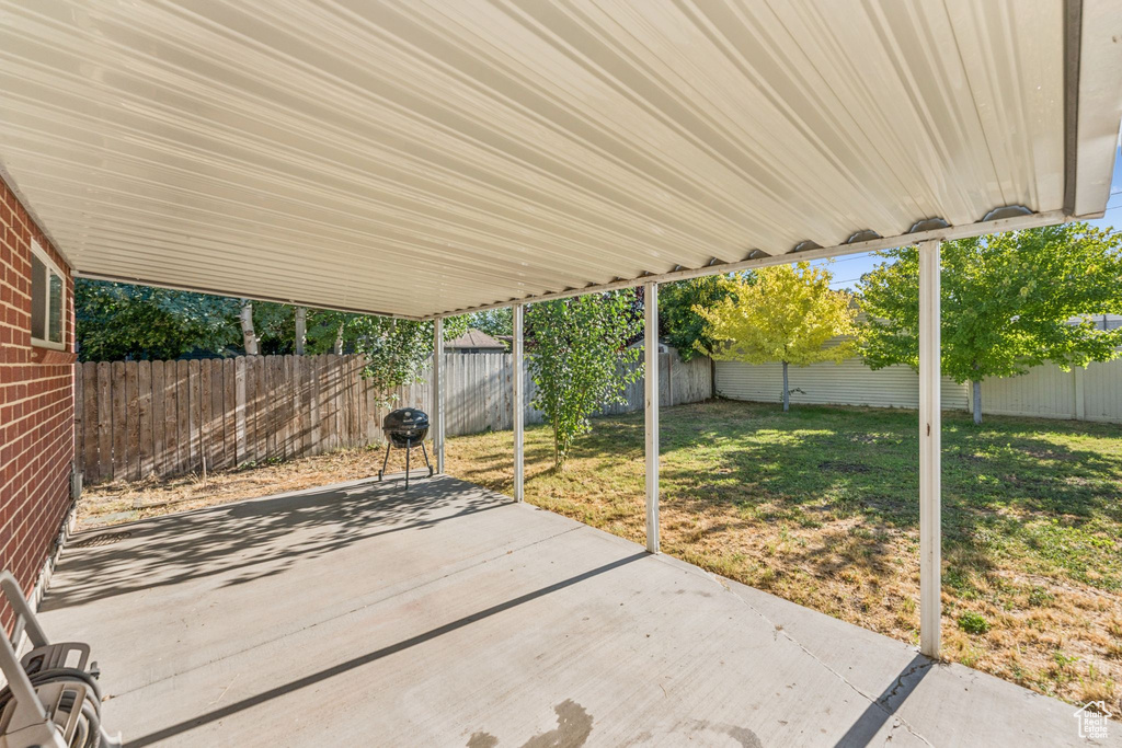 Fenced backyard with a patio area