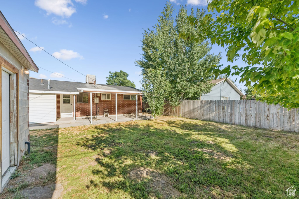 View of yard with a patio area