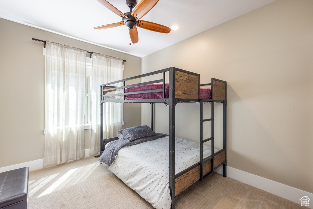 Bedroom featuring carpet and a ceiling fan