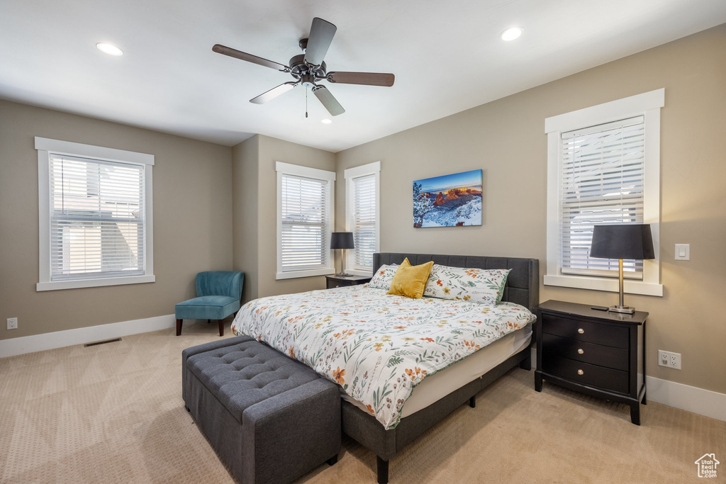 Bedroom featuring light carpet, recessed lighting, and ceiling fan