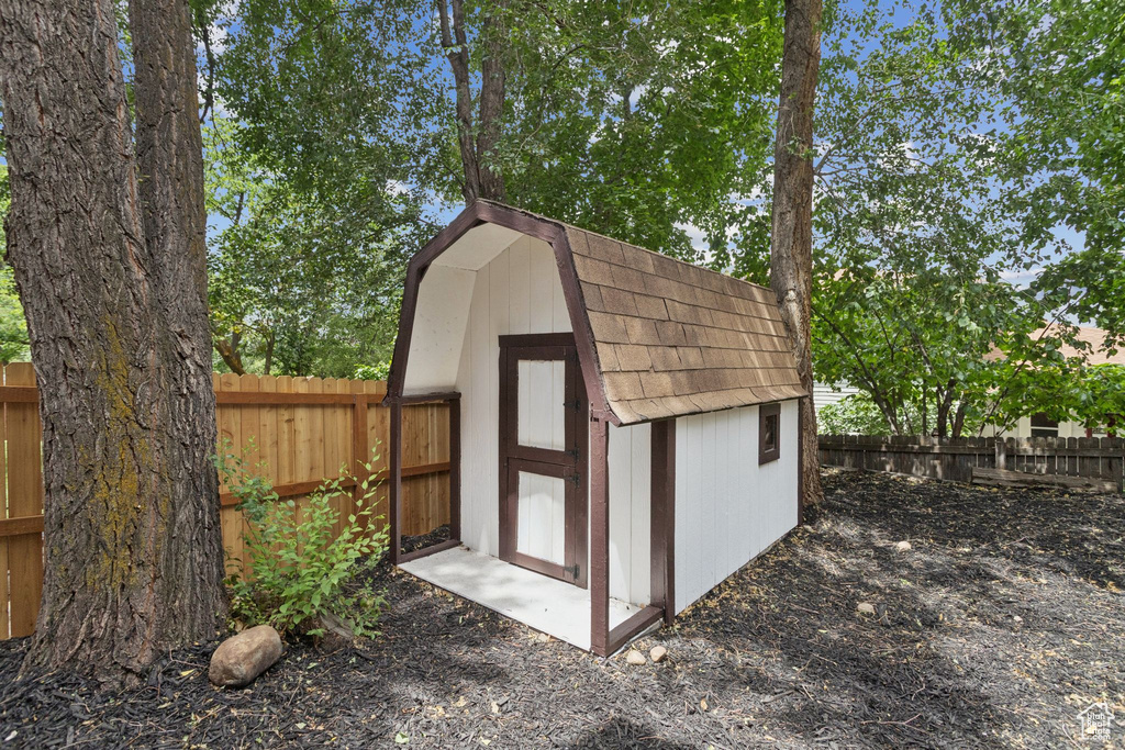 View of shed featuring a fenced backyard