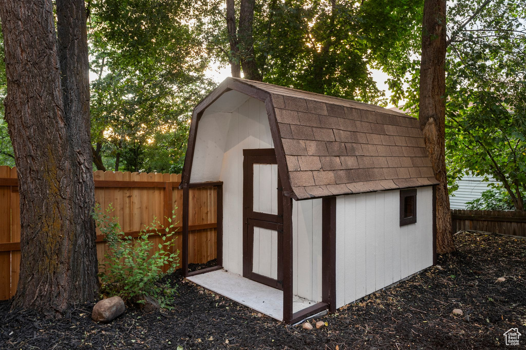 View of shed featuring a fenced backyard