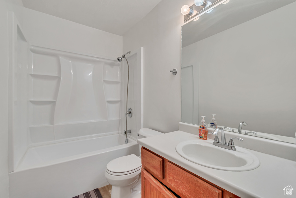 Full bathroom featuring vanity, shower / washtub combination, and wood finished floors