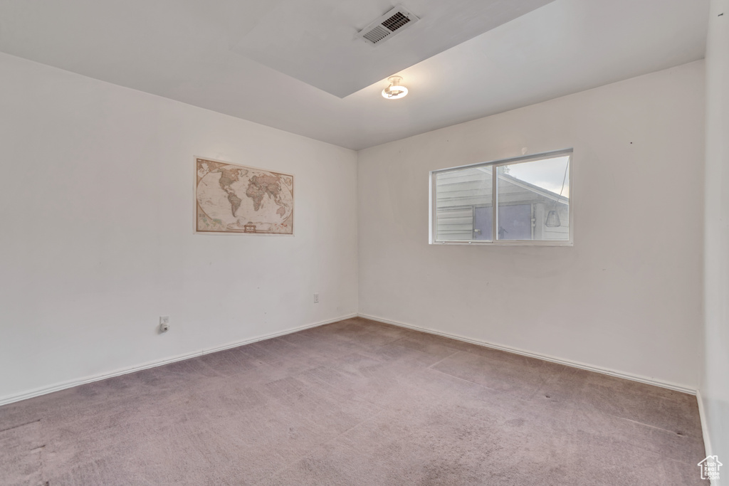 Spare room featuring carpet floors