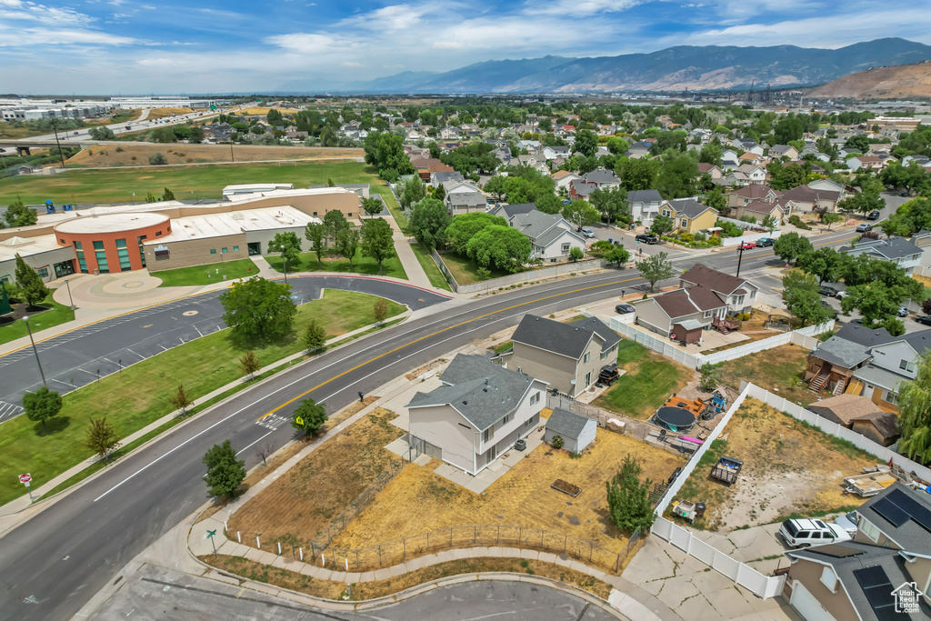Aerial perspective of suburban area featuring a mountain backdrop