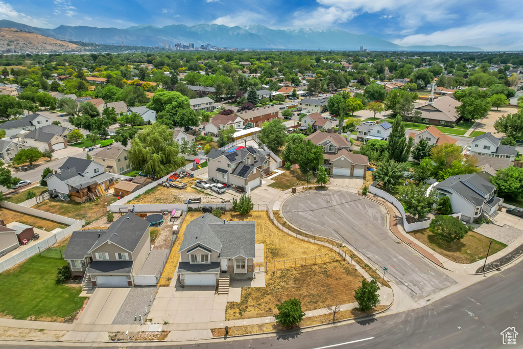 Aerial view of residential area featuring mountains