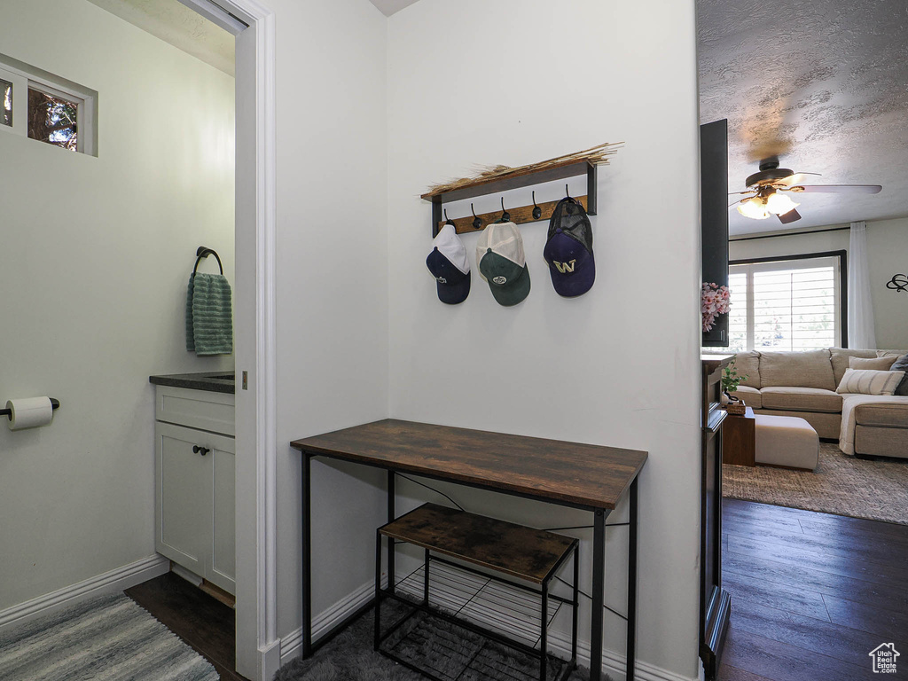 Corridor with baseboards and dark wood finished floors