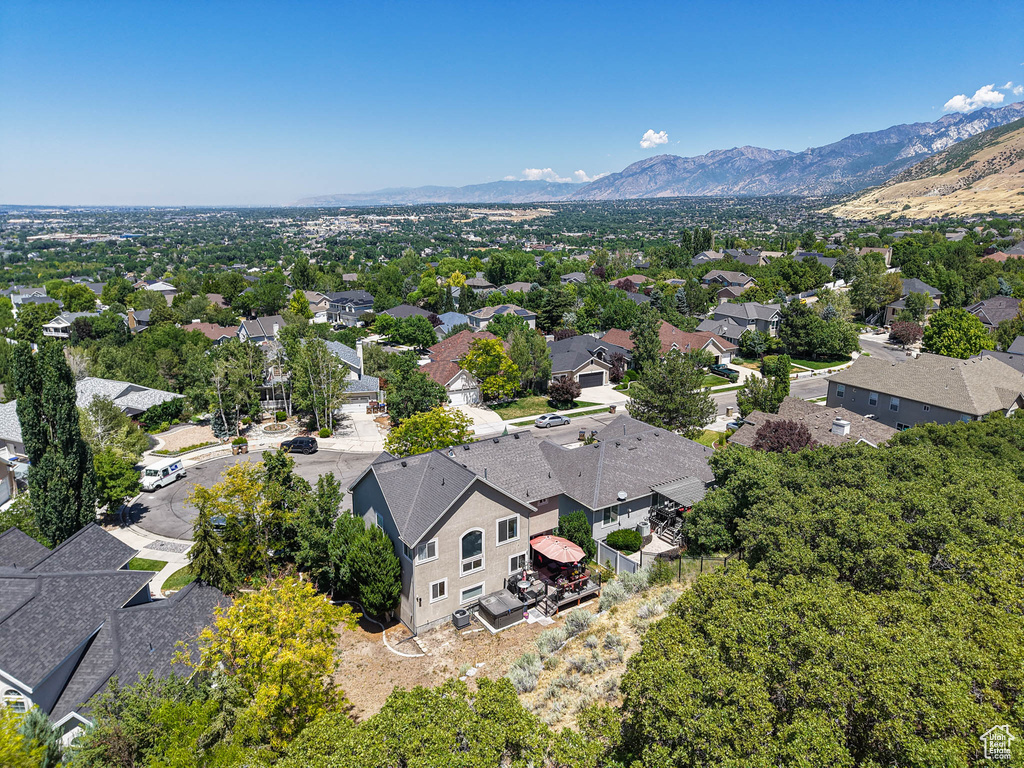 Aerial perspective of suburban area featuring a mountainous background