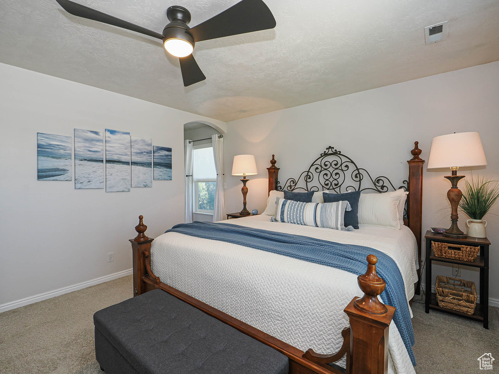 Bedroom with carpet flooring and ceiling fan