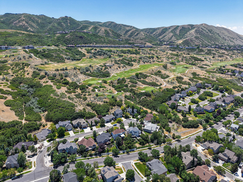 View of property location featuring a mountainous background and nearby suburban area