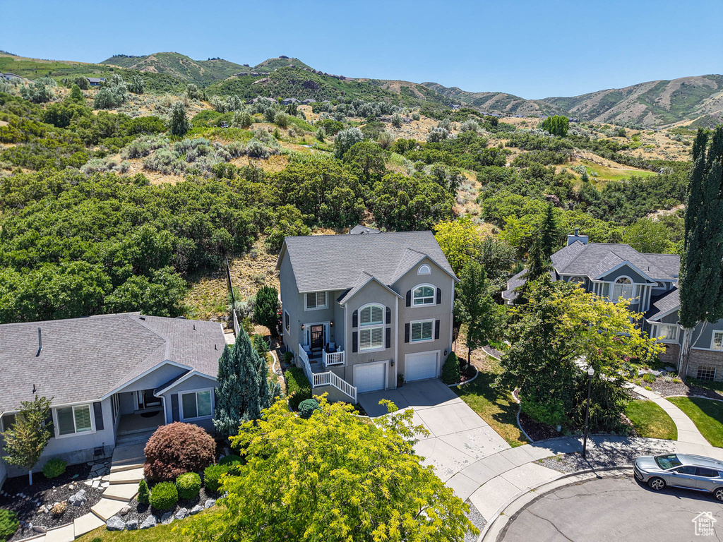 View from above of property with a mountainous background