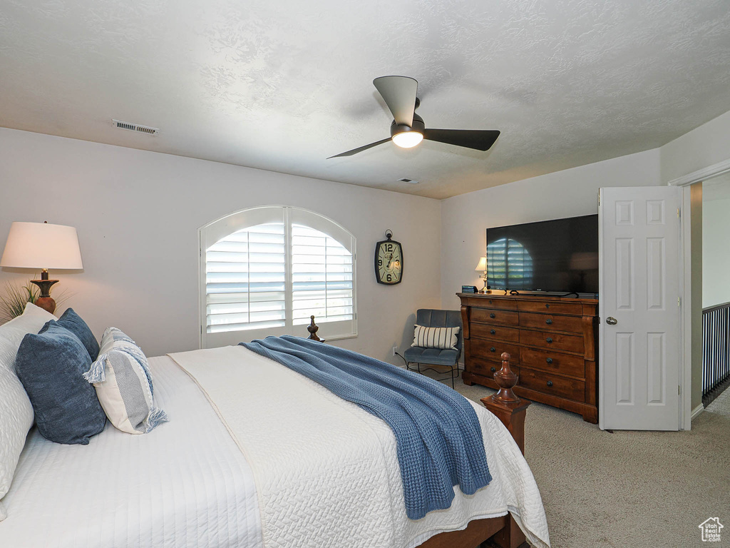 Bedroom with carpet floors and ceiling fan