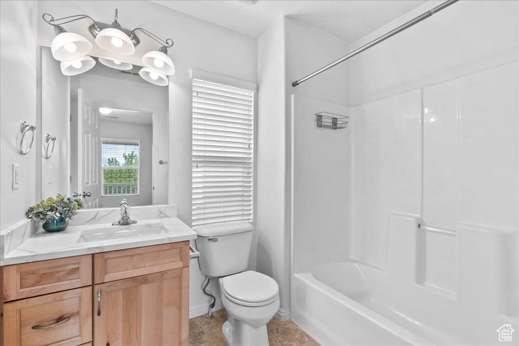 Bathroom featuring vanity and shower / bathtub combination