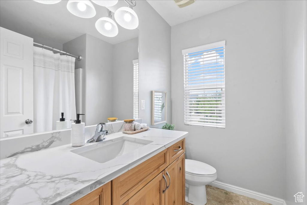 Bathroom featuring vanity and a shower with shower curtain