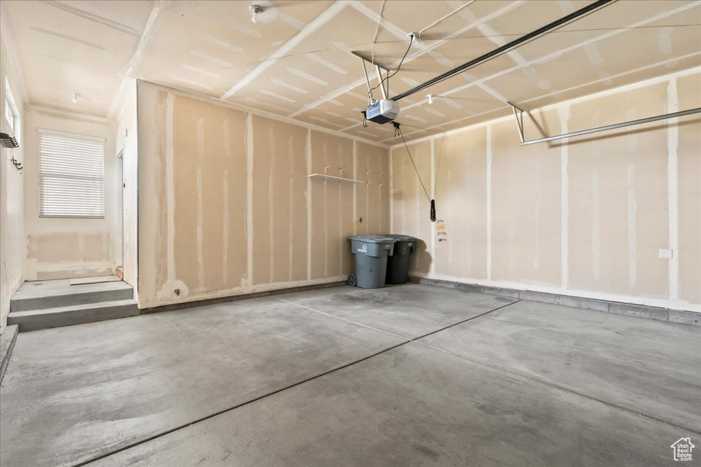Garage featuring a garage door opener
