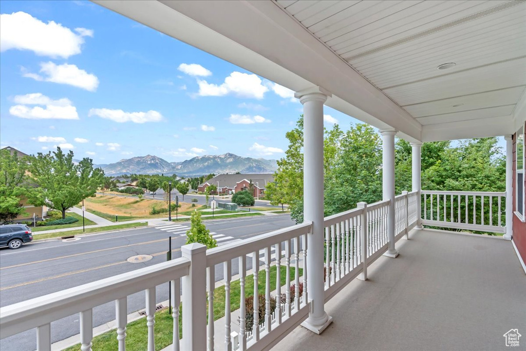 Porch featuring a mountain view