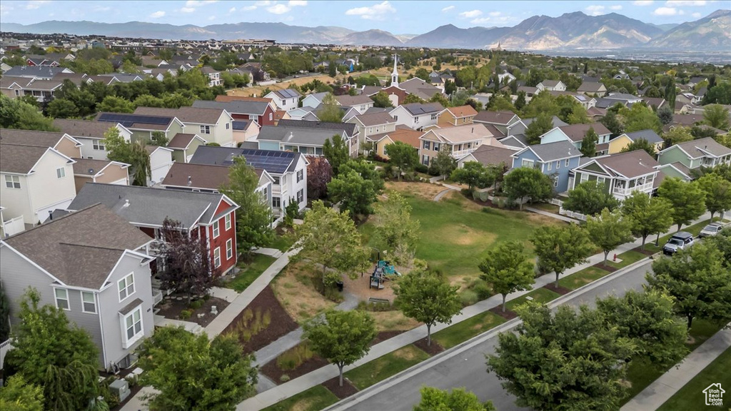 Aerial perspective of suburban area with a mountainous background