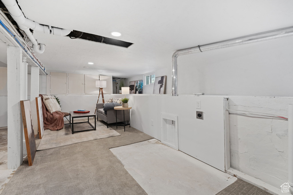 Laundry room with light carpet and recessed lighting