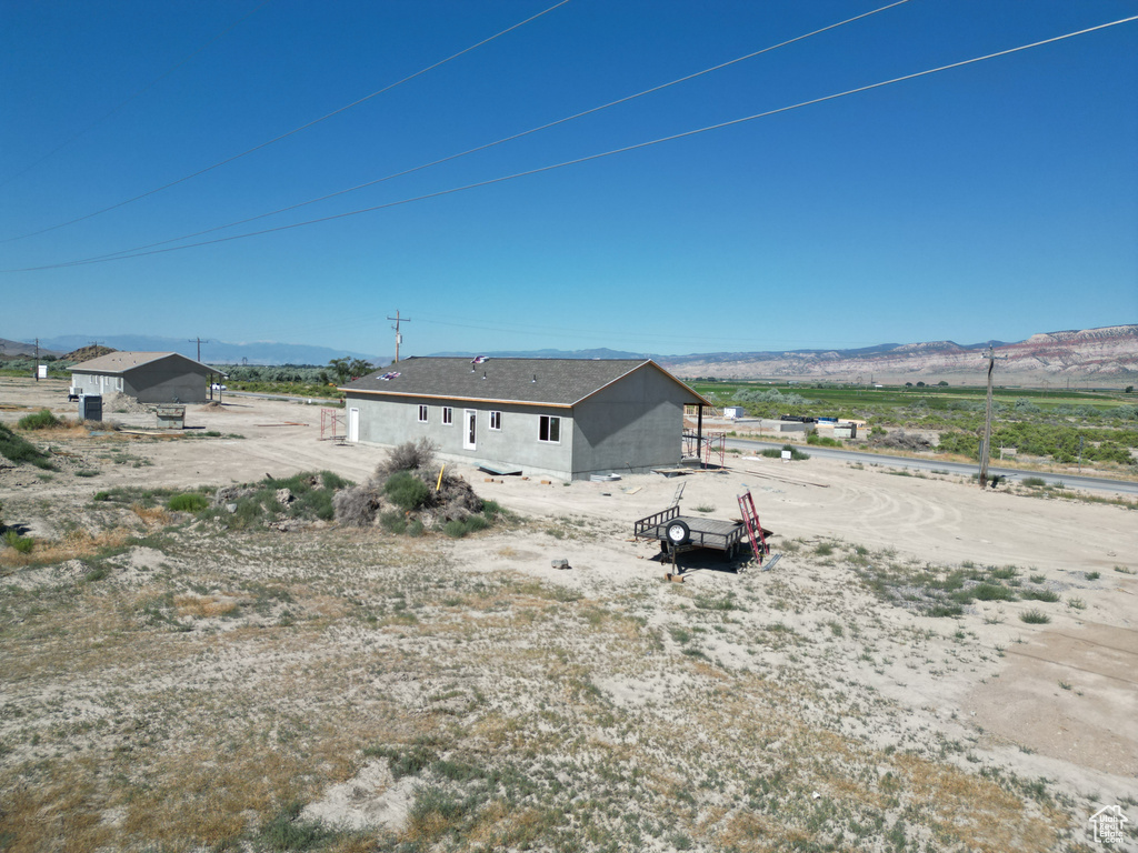 Rear view of house featuring a mountain view
