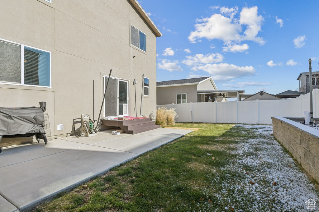Fenced backyard featuring a patio area