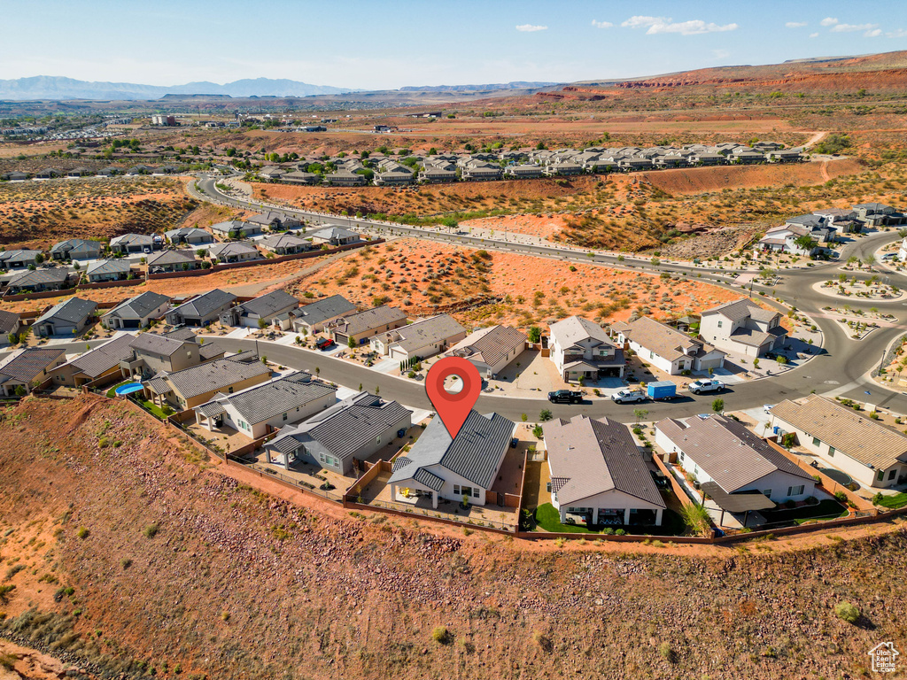 Aerial view of residential area with a mountainous background