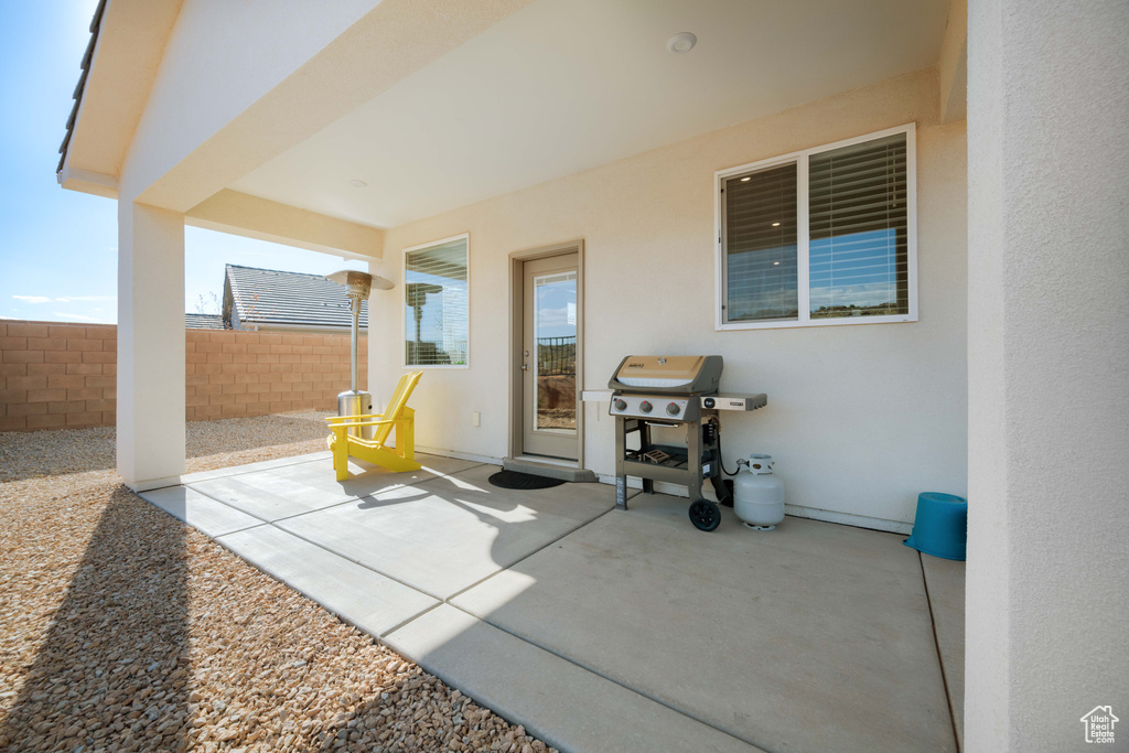 View of patio featuring a grill