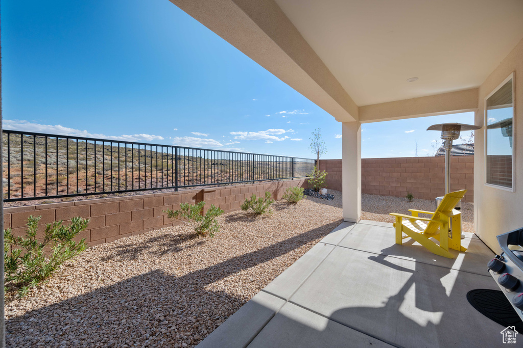 Fenced backyard with a patio area
