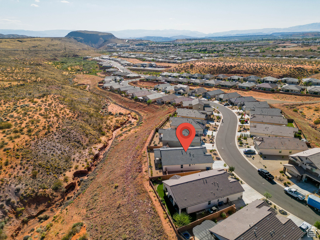 Aerial perspective of suburban area featuring a mountainous background