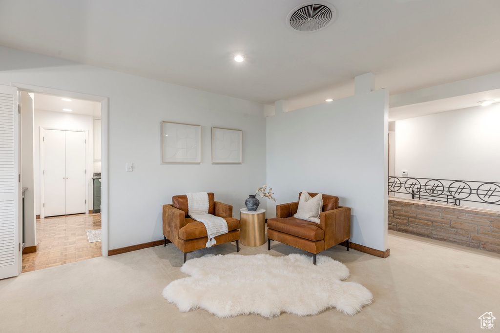 Sitting room featuring carpet flooring and recessed lighting