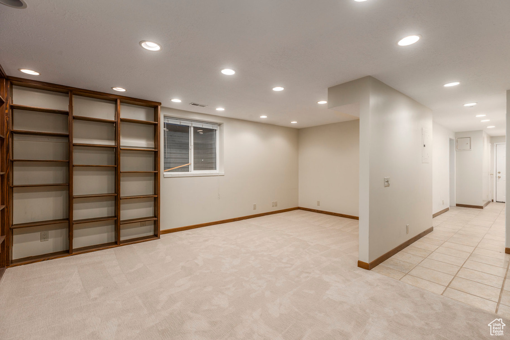 Below grade area with recessed lighting and light colored carpet