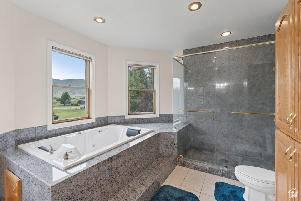 Bathroom with a shower stall, a jetted tub, tile patterned floors, and recessed lighting