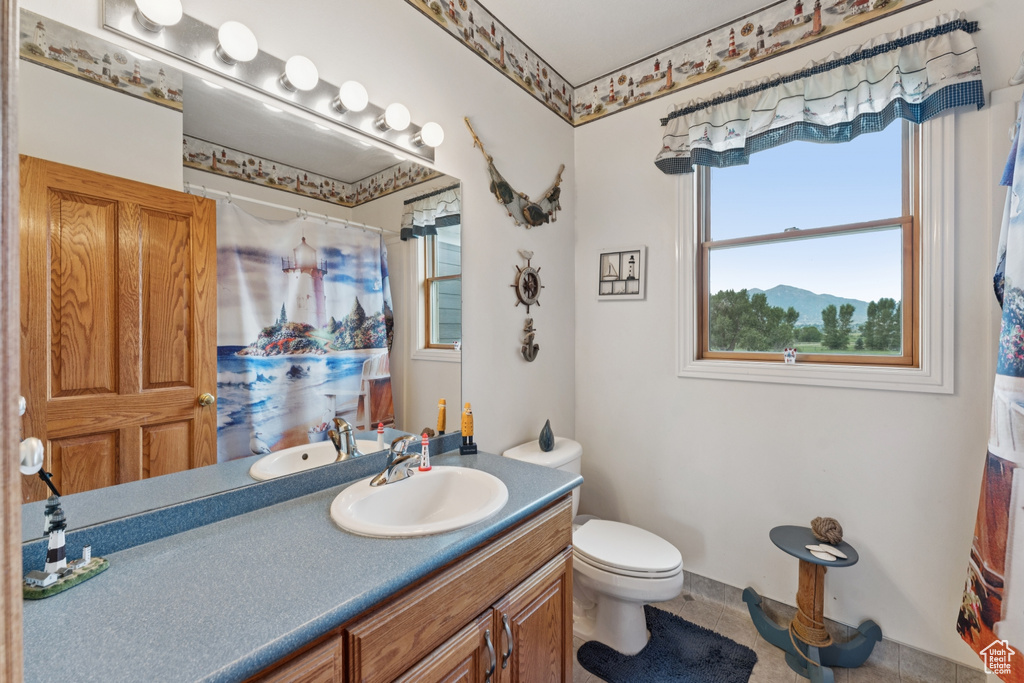 Full bathroom featuring vanity and a shower with curtain